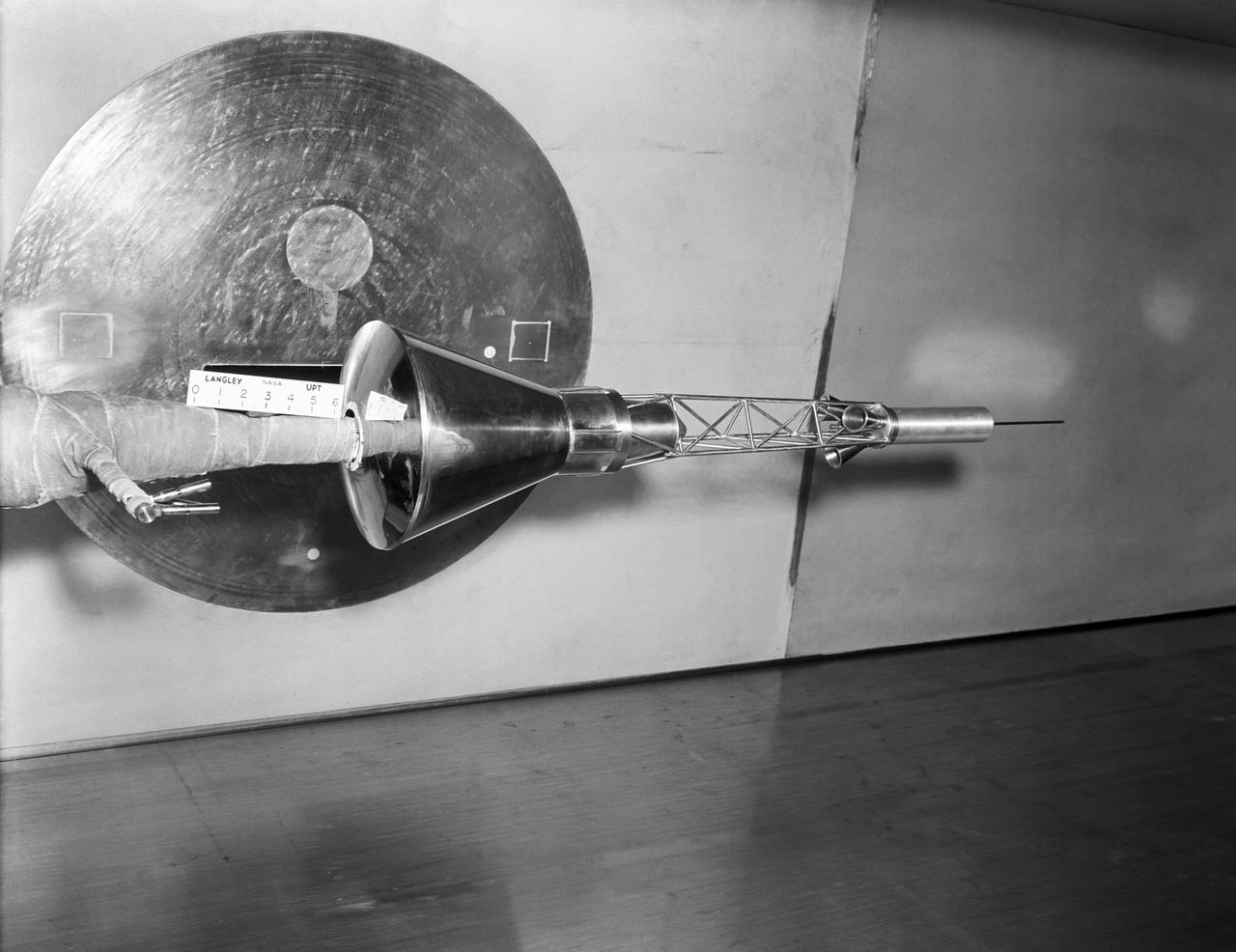 A one-sixth scale model of the Mercury capsule being tested in the 300-mph 7 x 10-foot wind tunnel.