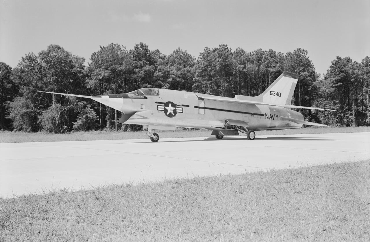 Crusader on runway. Navy aircraft number 6340. L59-6101 caption:  The Navy's Vought XF8U-3 Supersonic Fighter was an entirely new design as compared to the earlier F8U Crusader series. This jet plane lost in competition with the McDonnell F4H, however, and was never put into production. Langley used the XF8U-3 in some of the first flight measurements of sonic boom intensity.  Photograph published in Engineer in Charge A History of the Langley Aeronautical Laboratory, 1917-1958 by James R. Hansen. Page 507. Caption:  Chance Vought F8U-3 airplane used in sonic boom investigation at Wallops, June-August 1959.  Photograph published in A New Dimension  Wallops Island Flight Test Range: The First Fifteen Years by Joseph Shortal. A NASA publication. Page 672.