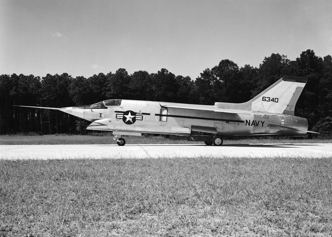 Crusader on runway. Navy aircraft number 6340. L59-6101 caption:  The Navy's Vought XF8U-3 Supersonic Fighter was an entirely new design as compared to the earlier F8U Crusader series. This jet plane lost in competition with the McDonnell F4H, however, and was never put into production. Langley used the XF8U-3 in some of the first flight measurements of sonic boom intensity.  Photograph published in Engineer in Charge A History of the Langley Aeronautical Laboratory, 1917-1958 by James R. Hansen. Page 507. Caption:  Chance Vought F8U-3 airplane used in sonic boom investigation at Wallops, June-August 1959.  Photograph published in A New Dimension  Wallops Island Flight Test Range: The First Fifteen Years by Joseph Shortal. A NASA publication. Page 672.