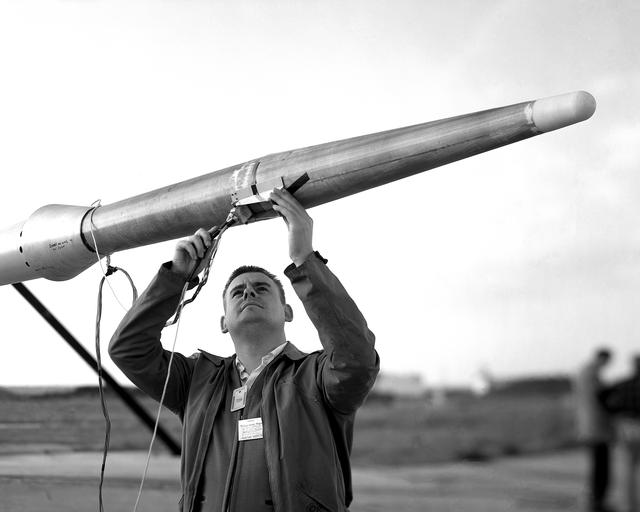 NASA image: First University of Michigan Strongarm sounding rocket on launcher at Wallops for test, November 10, 1959E5-188 Shop and Launcher Pictures