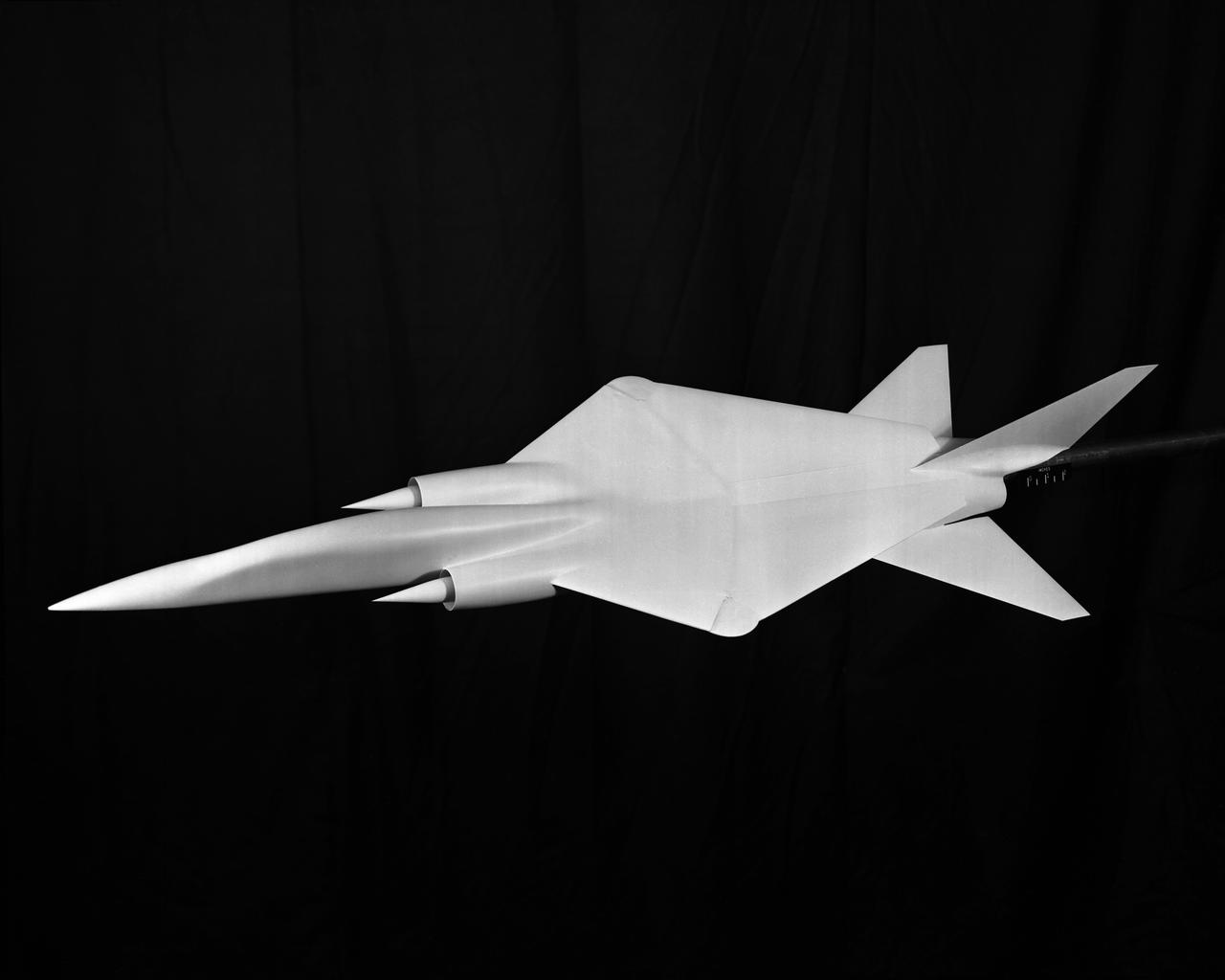 Project: Wing Sweep Range Series   TAC Variable Sweep Model configure 8 A. Taken at 8 foot tunnels building 641. L60-3412 through 3416 Model of proposed military supersonic attack airplane shows wing sweep range. TAC Models taken at the 8 Foot Tunnel. Photograph published in Sixty Years of Aeronautical Research 1917-1977 By David A. Anderton. A NASA publication. Page 53.