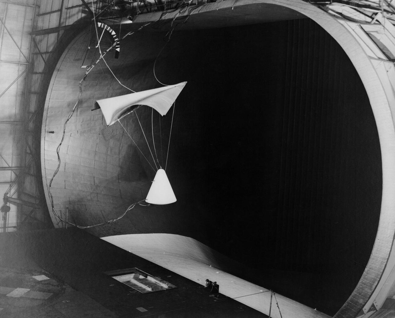 Image L61-4369 is available as an electronic file from the photo lab. See URL. -- Photographed on 06/30/1961. -- Test of parawing in Full Scale Wind Tunnel. -- Published in James R. Hansen, Spaceflight Revolution: NASA Langley Research Center From Sputnik to Apollo, (Washington: NASA, 1995), pp. 380-387.