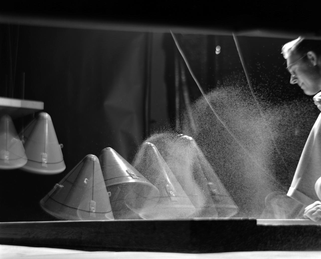 Image L61-8036 is available as an electronic file from the photo lab. See URL. -- Photographed on 12/05/1961. -- Multiple exposure of an impact test of the Apollo command module.  In this test the Apollo capsule was tested making a sand landing. -- Published in James R. Hansen, Spaceflight Revolution: NASA Langley Research Center From Sputnik to Apollo, (Washington: NASA, 1995), pp. 361-366.