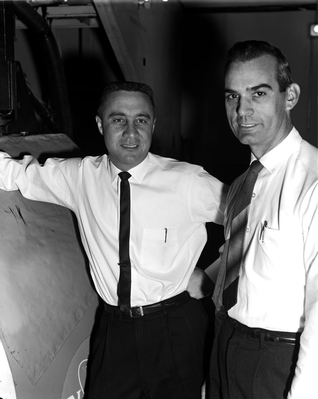 Astronaut Virgil "Gus" Grissom at the controls of the Visual Docking Simulator. From A.W. Vogeley, "Piloted Space-Flight Simulation at Langley Research Center," Paper presented at the American Society of Mechanical Engineers 1966 Winter Meeting, New York, NY, November 27-December 1, 1966. "This facility was [later known as the Visual-Optical Simulator.] It presents to the pilot an out-the-window view of his target in correct 6 degrees of freedom motion. The scene is obtained by a television camera pick-up viewing a small-scale gimbaled model of the target." "For docking studies, the docking target picture was projected onto the surface of a 20-foot-diameter sphere and the pilot could, effectively, maneuver into contract. this facility was used in a comparison study with the Rendezvous Docking Simulator - one of the few comparison experiments in which conditions were carefully controlled and a reasonable sample of pilots used. All pilots preferred the more realistic RDS visual scene. The pilots generally liked the RDS angular motion cues although some objected to the false gravity cues that these motions introduced. Training time was shorter on the RDS, but final performance on both simulators was essentially equal. " "For station-keeping studies, since close approach is not required, the target was presented to the pilot through a virtual-image system which projects his view to infinity, providing a more realistic effect. In addition to the target, the system also projects a star and horizon background. "