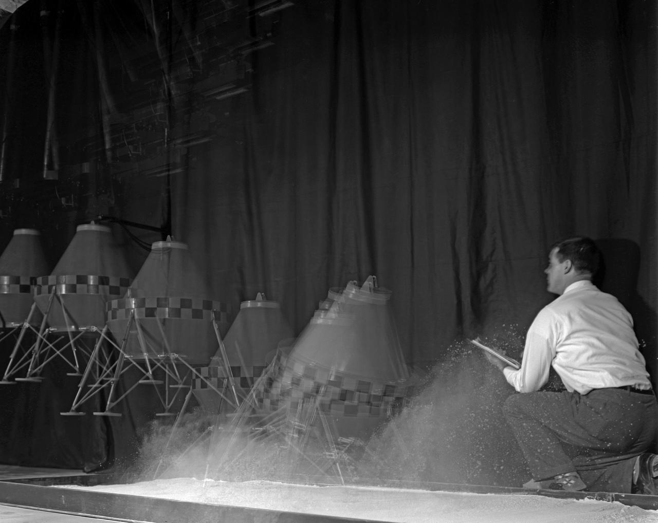 Multiple exposure of a test with a prototype Lunar Excursion Module. This test was one of many conducted at Langley of the structural dynamics of lunar landing.