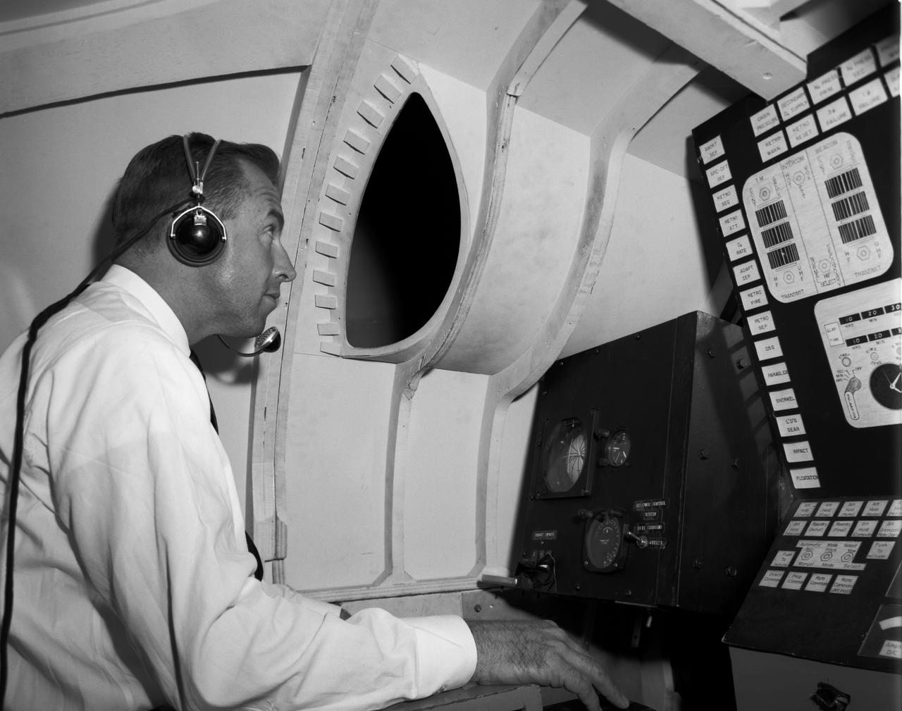 Astronaut James Lovell at the controls of the Visual Docking Simulator. From A.W. Vogeley, "Piloted Space-Flight Simulation at Langley Research Center," Paper presented at the American Society of Mechanical Engineers 1966 Winter Meeting, New York, NY, November 27-December 1, 1966. "This facility was [later known as the Visual-Optical Simulator.] It presents to the pilot an out-the-window view of his target in correct 6 degrees of freedom motion. The scene is obtained by a television camera pick-up viewing a small-scale gimbaled model of the target." "For docking studies, the docking target picture was projected onto the surface of a 20-foot-diameter sphere and the pilot could, effectively, maneuver into contract. this facility was used in a comparison study with the Rendezvous Docking Simulator - one of the few comparison experiments in which conditions were carefully controlled and a reasonable sample of pilots used. All pilots preferred the more realistic RDS visual scene. The pilots generally liked the RDS angular motion cues although some objected to the false gravity cues that these motions introduced. Training time was shorter on the RDS, but final performance on both simulators was essentially equal. " "For station-keeping studies, since close approach is not required, the target was presented to the pilot through a virtual-image system which projects his view to infinity, providing a more realistic effect. In addition to the target, the system also projects a star and horizon background. "