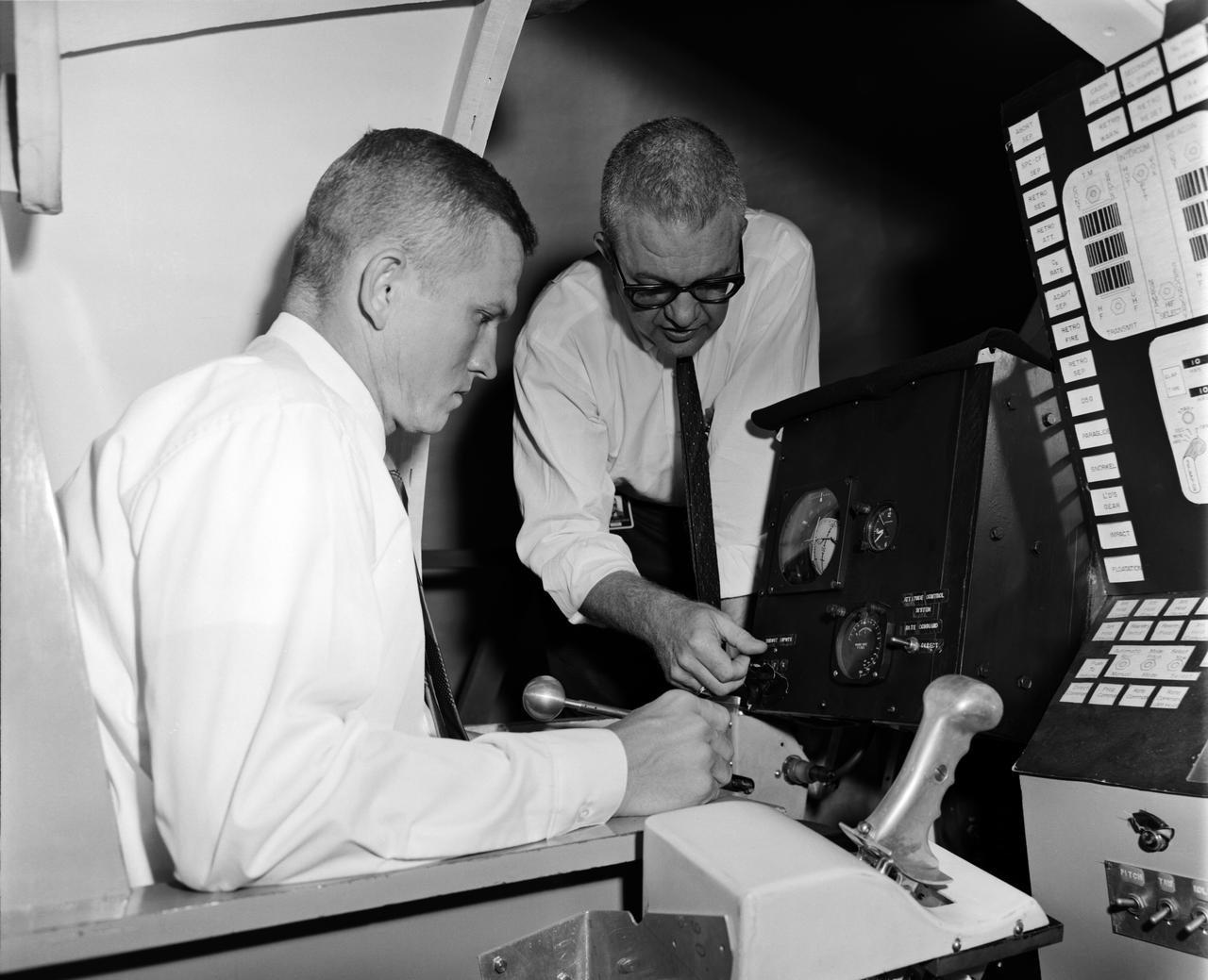 Astronaut Frank Borman at the controls of the Visual Docking Simulator. From A.W. Vogeley, "Piloted Space-Flight Simulation at Langley Research Center," Paper presented at the American Society of Mechanical Engineers 1966 Winter Meeting, New York, NY, November 27-December 1, 1966. "This facility was [later known as the Visual-Optical Simulator.] It presents to the pilot an out-the-window view of his target in correct 6 degrees of freedom motion. The scene is obtained by a television camera pick-up viewing a small-scale gimbaled model of the target." "For docking studies, the docking target picture was projected onto the surface of a 20-foot-diameter sphere and the pilot could, effectively, maneuver into contract. this facility was used in a comparison study with the Rendezvous Docking Simulator - one of the few comparison experiments in which conditions were carefully controlled and a reasonable sample of pilots used. All pilots preferred the more realistic RDS visual scene. The pilots generally liked the RDS angular motion cues although some objected to the false gravity cues that these motions introduced. Training time was shorter on the RDS, but final performance on both simulators was essentially equal. " "For station-keeping studies, since close approach is not required, the target was presented to the pilot through a virtual-image system which projects his view to infinity, providing a more realistic effect. In addition to the target, the system also projects a star and horizon background. "