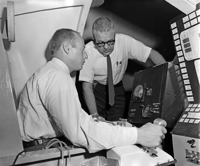 NASA image: Charles P. Conrad, Jr. and John Young in Visual Docking Simulator