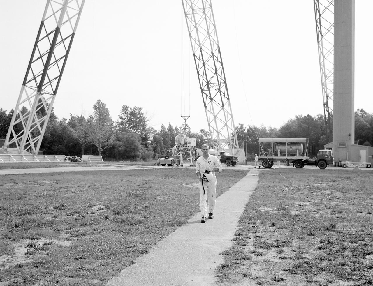 Astronaut Eugene Cernan at Lunar Lander Research Facility. Cernan under gantry, in training module.  Captain Cernan was one of fourteen astronauts selected by NASA in October 1963. On his second space flight, he was lunar module pilot of Apollo 10, May 18-26, 1969, the first comprehensive lunar-orbital qualification and verification flight test of an Apollo lunar module.