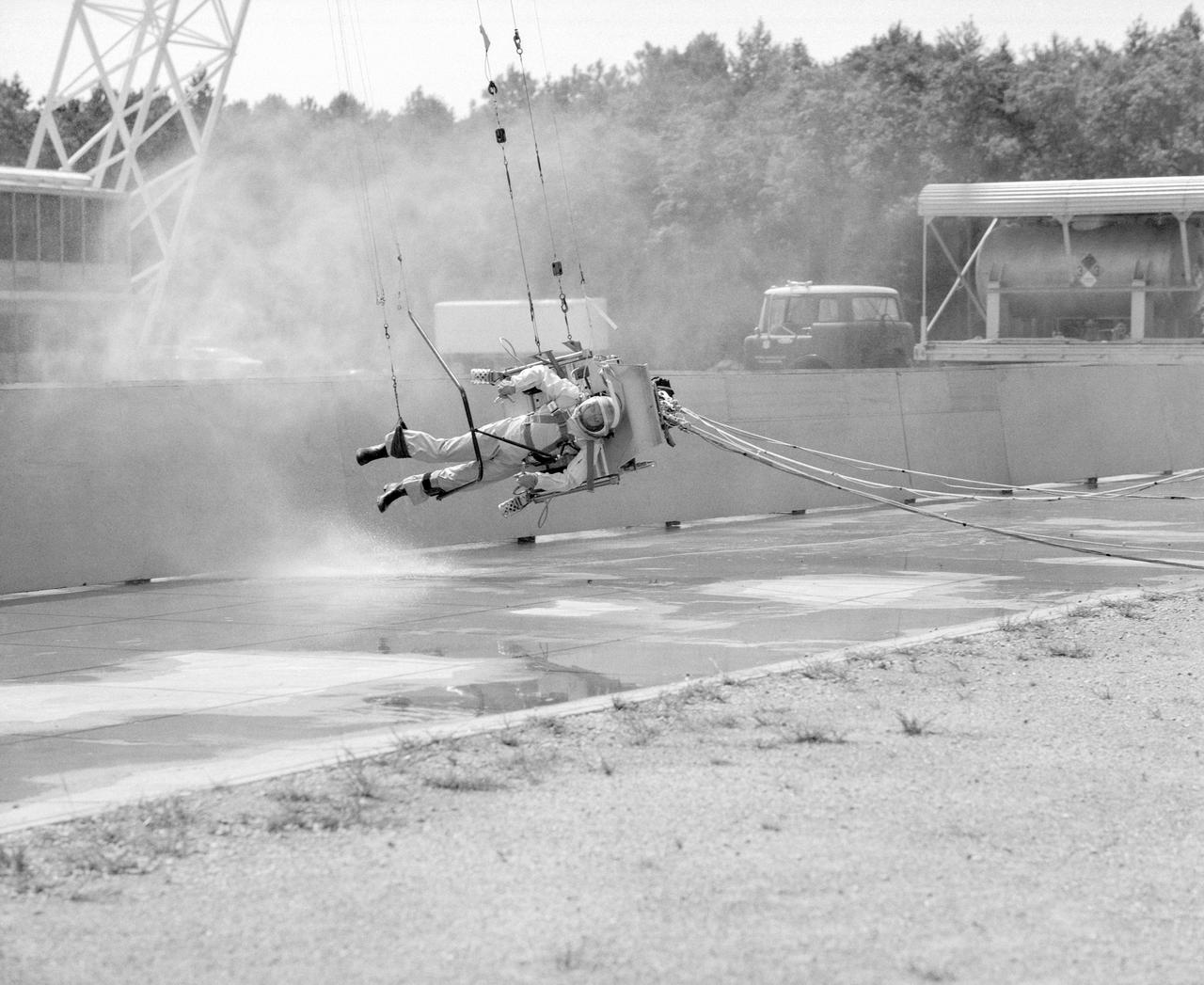 ICARUS - Lunar Walker with Pilot Dick Yenni.   Yenni in ICARUS rig for jet propelled lunar mobility, at Lunar Landing Research Facility gantry.