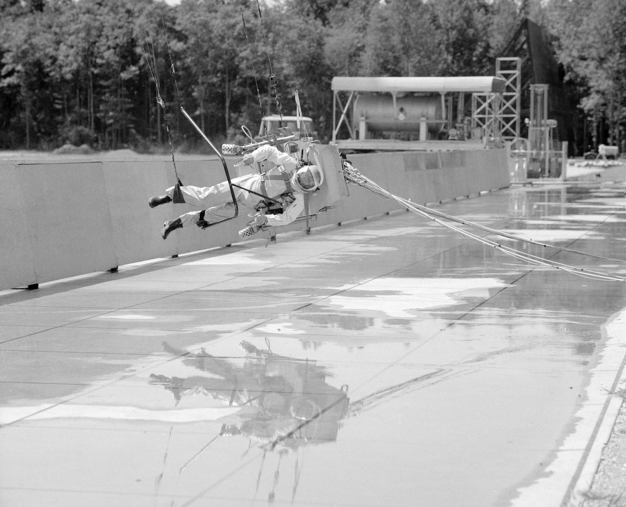ICARUS - Lunar Walker with Pilot Dick Yenni.   Yenni in ICARUS rig for jet propelled lunar mobility, at Lunar Landing Research Facility gantry.