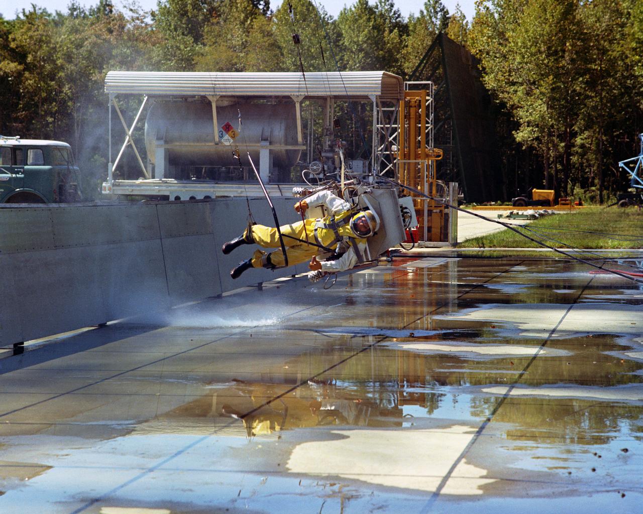 Icarus Lunar Walker,Lunar Landing Research Facility. Langley study of the backpack propulsion unit, by Bell Aerosystems.  Icarus full scale test at Lunar Landing Research Facility - low gravity simulator. A NASA Langley researcher moon walks  under the Lunar Landing Research Facility's gantry. More information on this can be read in the Document.  "STUDIES OF PILOTING PROBLEMS OF ONE-MAN FLYING UNITS OPERATED IN SIMULATED LUNAR GRAVITY"  BY Donald E. Hewes