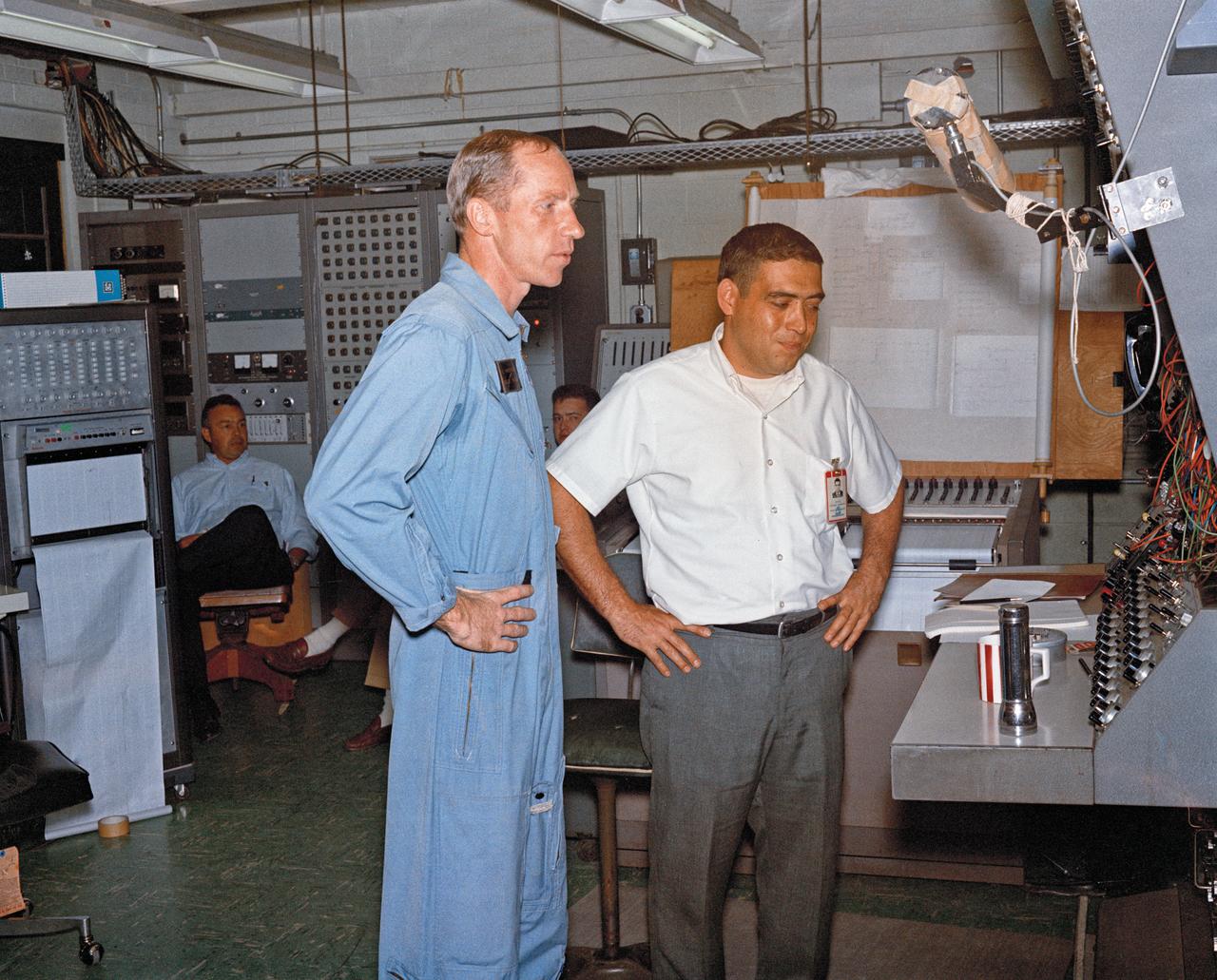 Astronauts Stuart A. Roosa, and Alfred M. Worden training a tRendezvous Docking Simulator NASA Langley.  Worden was one of the 19 astronauts selected by NASA in April 1966. He served as a member of the astronaut support crew for the Apollo 9 flight and as backup command module pilot for the Apollo 12 flight. Colonel Roosa was one of the 19 astronauts selected by NASA in April 1966. He was a member of the astronaut support crew for the Apollo 9 flight.