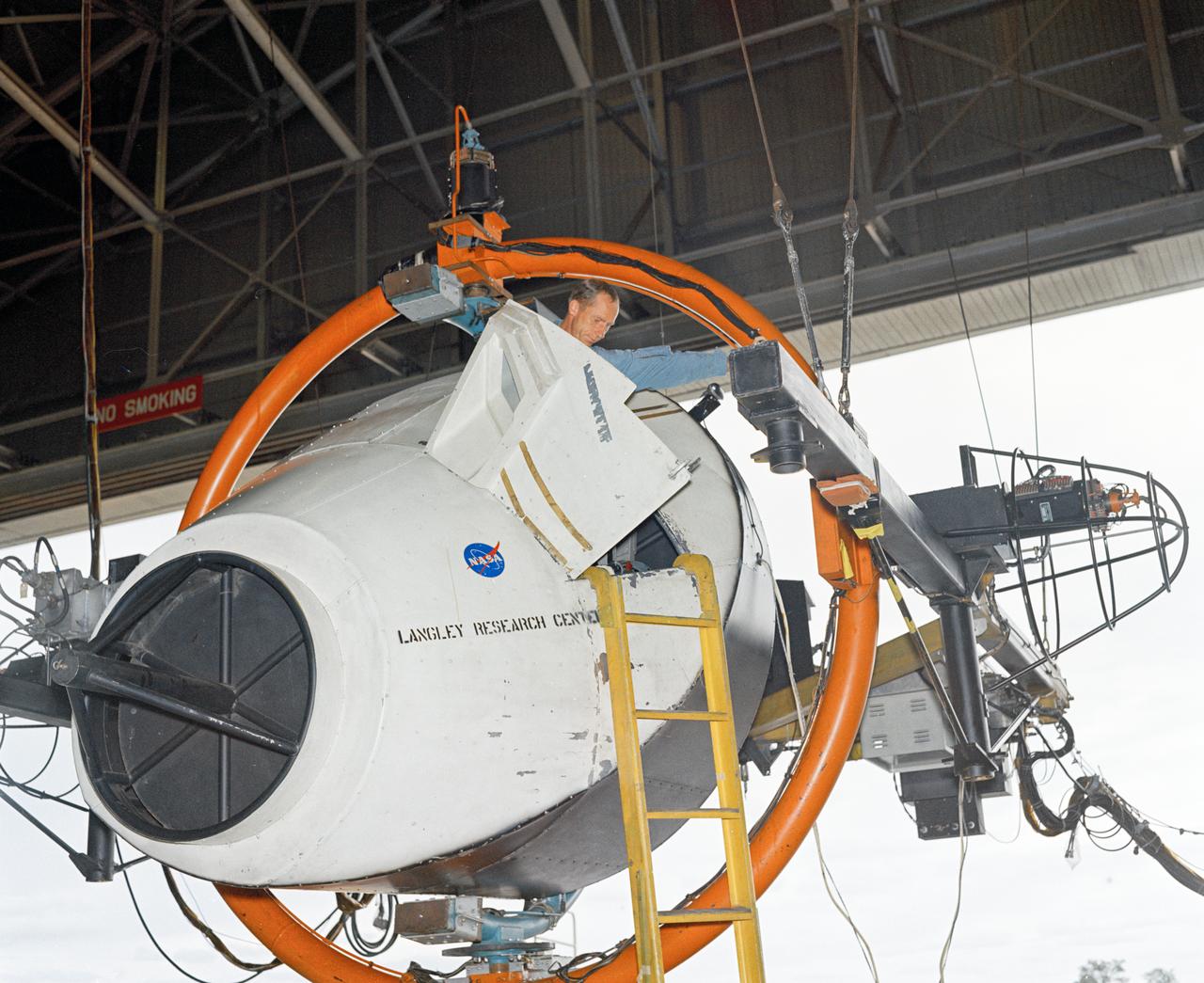 Astronauts Stuart A. Roosa, and Alfred M. Worden training a tRendezvous Docking Simulator NASA Langley.  Worden was one of the 19 astronauts selected by NASA in April 1966. He served as a member of the astronaut support crew for the Apollo 9 flight and as backup command module pilot for the Apollo 12 flight. Colonel Roosa was one of the 19 astronauts selected by NASA in April 1966. He was a member of the astronaut support crew for the Apollo 9 flight.