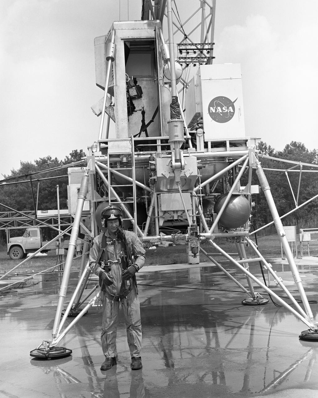 Astronaut Edwin  Buzz  Aldrin Lunar Module Pilot  at the (LLRF) Lunar Landing Research Facility. Aldrin was one of the third group of astronauts named by NASA in October 1963. On November 11, 1966, he and command pilot James Lovell were launched into space in the Gemini 12 spacecraft on a 4-day flight, which brought the Gemini program to a successful close. Aldrin established a new record for extravehicular activity (EVA), spending 5-1/2 hours outside the spacecraft. He served as lunar module pilot for Apollo 11, July 16-24, 1969, the first manned lunar landing mission. Aldrin followed Neil Armstrong onto the lunar surface on July 20, 1969, completing a 2-hour and 15 minute lunar EVA. In July 1971, Aldrin resigned from NASA. Aldrin has logged 289 hours and 53 minutes in space, of which, 7 hours and 52 minutes were spent in EVA. https://www.nasa.gov/astronauts/biographies/former