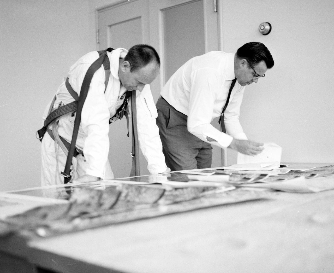 Astronauts Conrad and Bean at Lunar Landing Research Facility.  Alan Bean was one of the third group of astronauts named by NASA in October 1963. He served as backup astronaut for the Gemini 10 and Apollo 9 missions. In September of 1962, Mr. Conrad was selected as an astronaut by NASA. His first flight was Gemini V, which established the space endurance record and placed the United States in the lead for man-hours in space. As commander of Gemini XI, Mr. Conrad helped to set a world's altitude record. He then served as commander of Apollo XII, the second lunar landing. On Mr. Conrad's final mission, he served as commander of Skylab II, the first United States Space Station. https://www.nasa.gov/astronauts/biographies/former for more information.