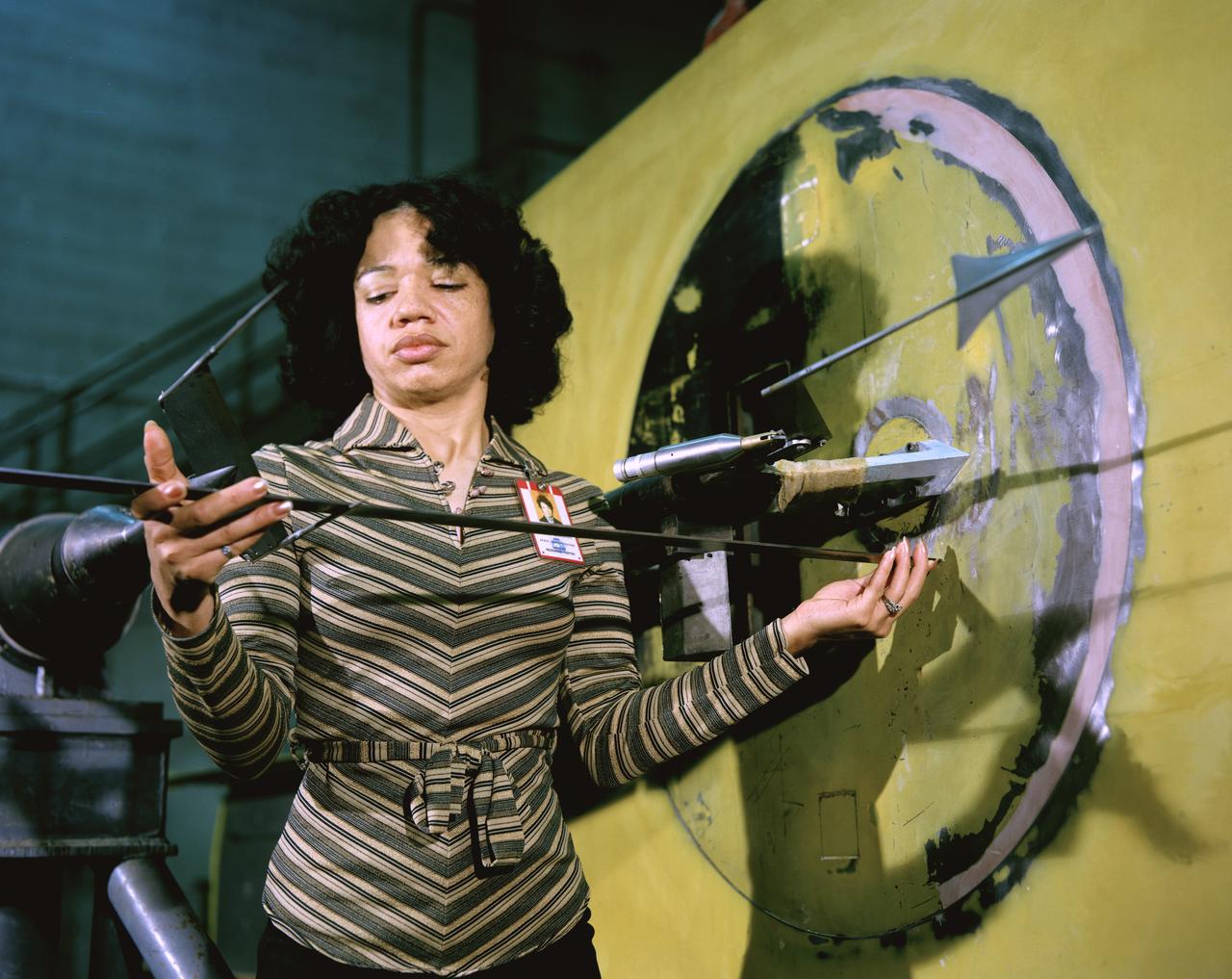 Sonic Boom test model and measuring probe rake with Christine Darden 