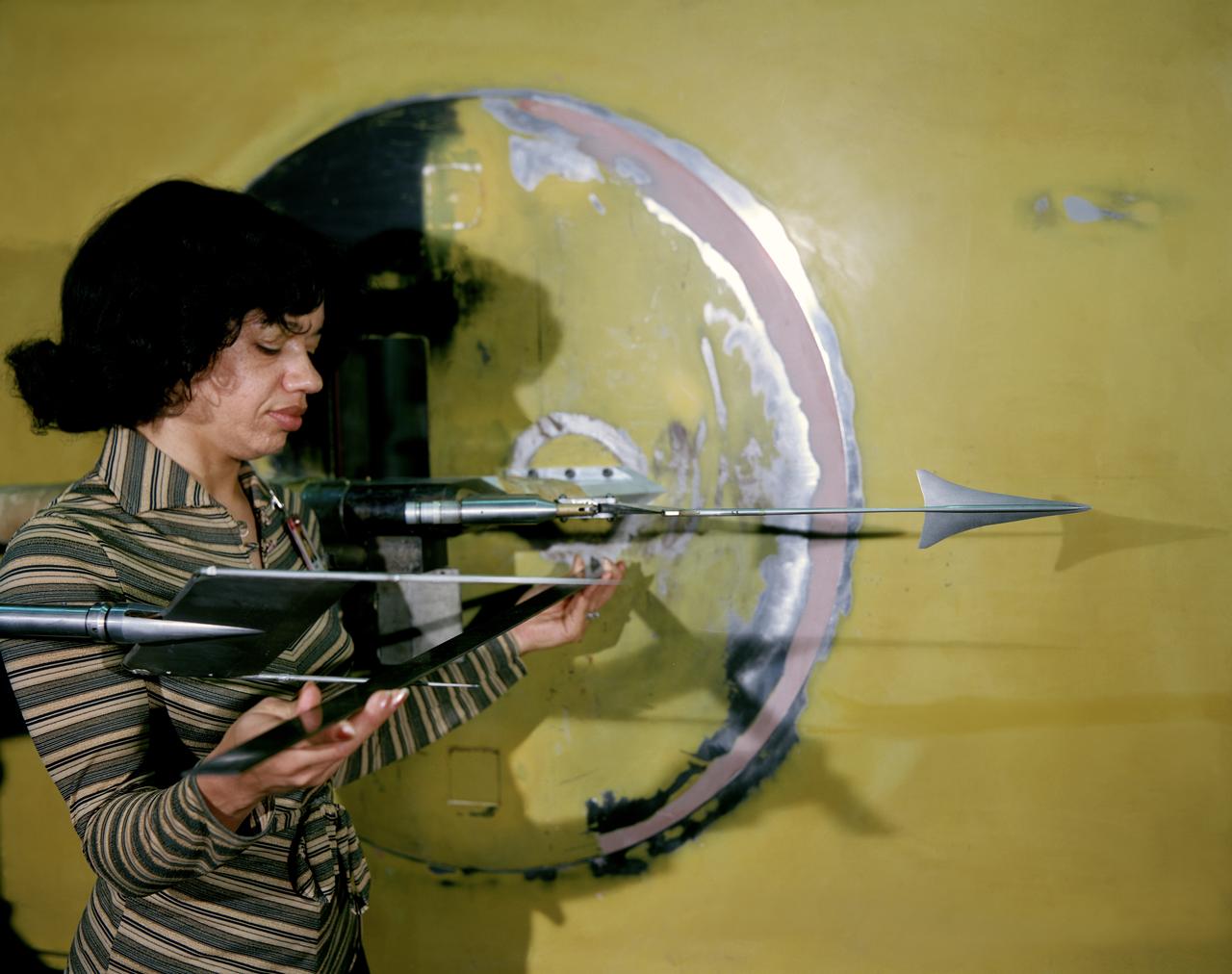 Sonic Boom test model and measuring probe rake with Christine Darden 