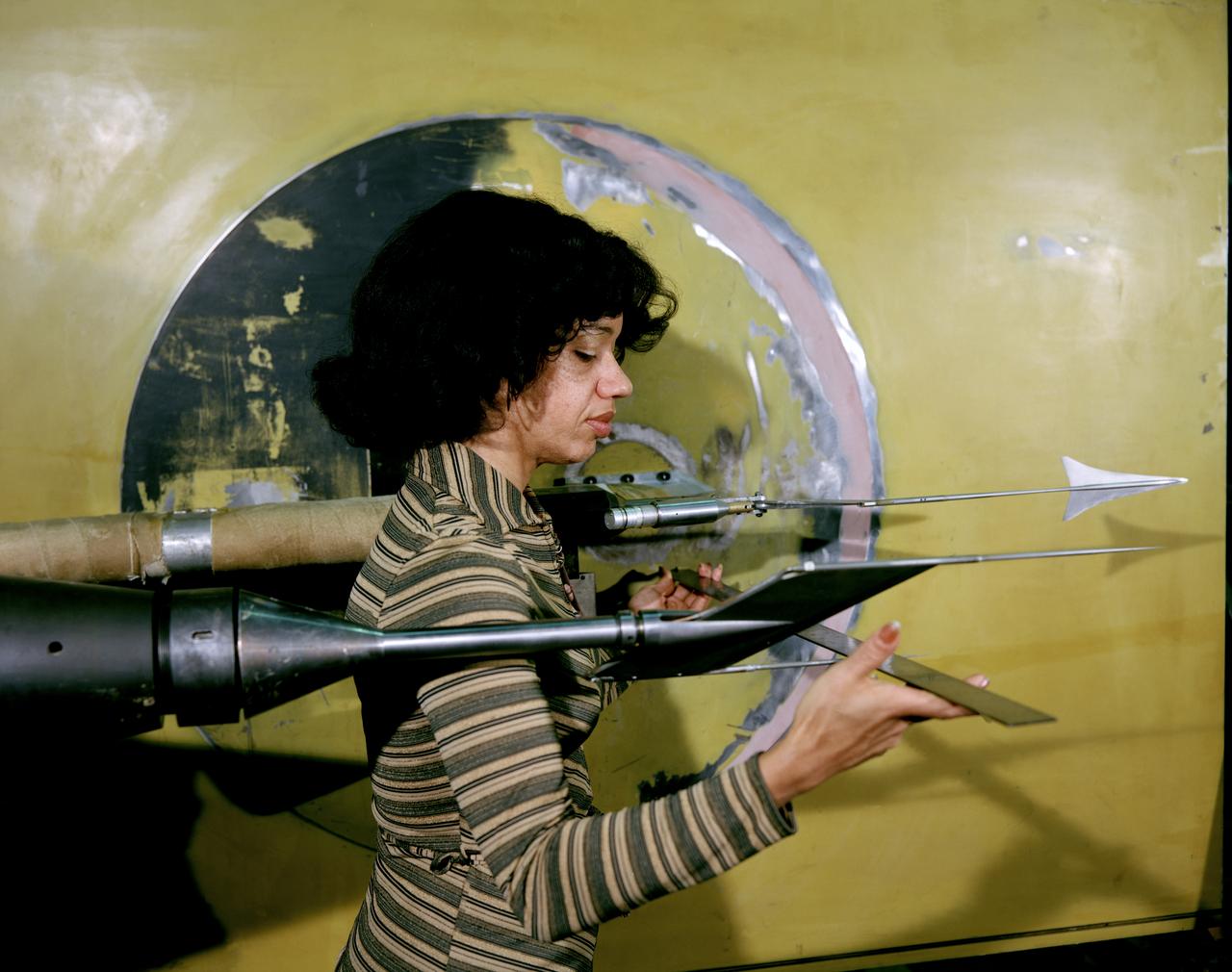 Sonic Boom test model and measuring probe rake with Christine Darden 