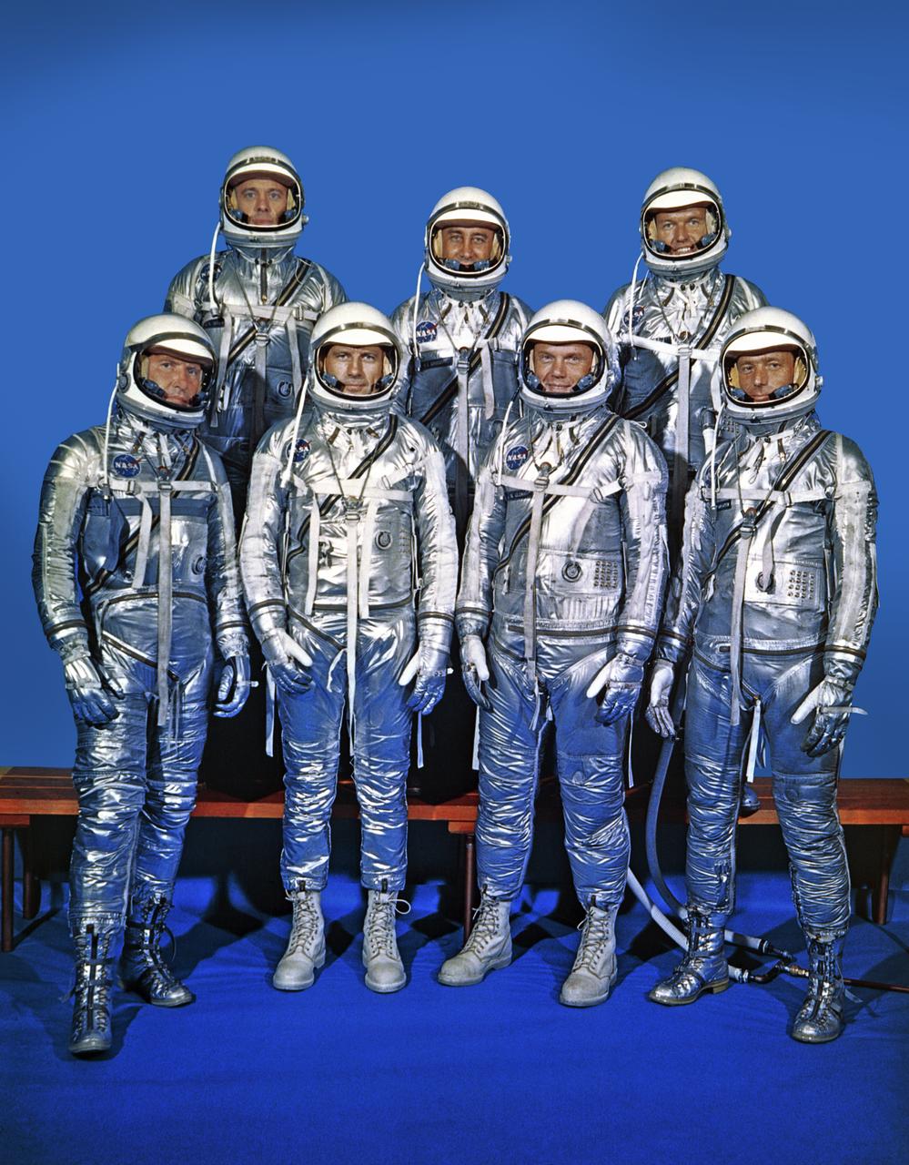 Press release information, September 13, 1968: "FIRST ASTRONAUT TEAM: Project Mercury Astronauts, whose selection was announced on April 9, 1959, only six months after the National Aeronautics and Space Administration was formally established on Oct. 1, 1958, Included: Front row, left to right, Walter M. Schirra, Jr., Donald K. Slayton, John H. Glenn, Jr., and M. Scott Carpenter; back row, Alan B. Shepard, Jr., Virgil I. "Gus" Grissom and L. Gordon Cooper. (1962), *89-361 Also in B&W.  This copy of original negative was edited without shadows in the background.  Photo taken at NASA Langley Research Center by Life Magazine photographer and negative copied for other centers.