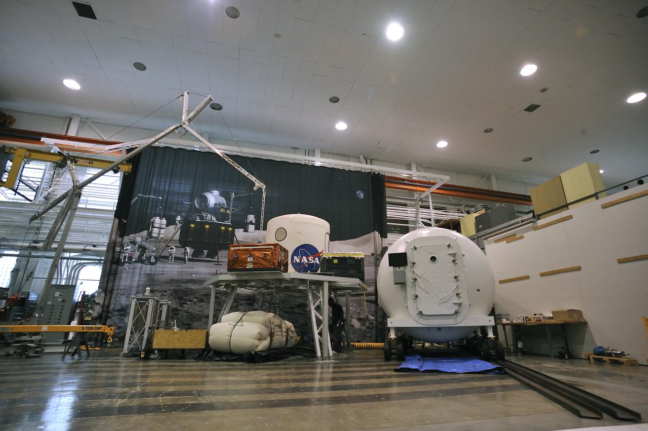 Expandable Lunar Habitat (X-Hab).ILC Dover, under contract by NASA Langley Research Center, and in cooperation with NASA Johnson Space Center has designed and manufactured an expandable lunar habitat. This cylindrical habitat, or Expandable Lunar Habitat (X-Hab) is a hybrid system with two hard end caps and a deployable softgoods section in the center.