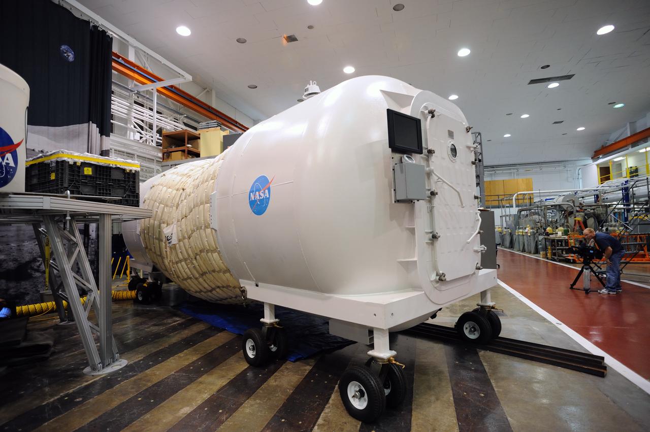 Expandable Lunar Habitat (X-Hab).ILC Dover, under contract by NASA Langley Research Center, and in cooperation with NASA Johnson Space Center has designed and manufactured an expandable lunar habitat. This cylindrical habitat, or Expandable Lunar Habitat (X-Hab) is a hybrid system with two hard end caps and a deployable softgoods section in the center.