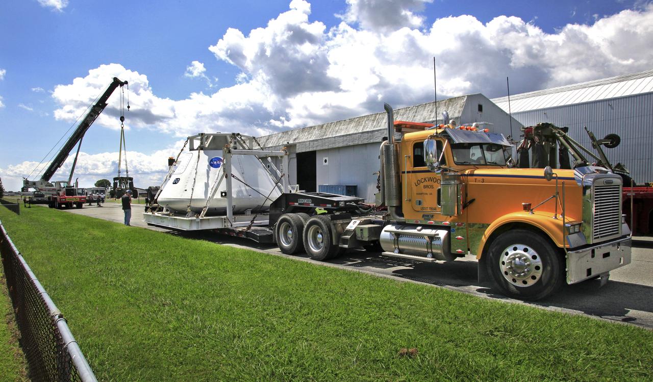 Orion Test Capsule loaded on a flatbed trailer at NASA Langley to be transport to Fort Eustis, VA. where it will be transported by barge to Norfolk Va. for open water recovery test.