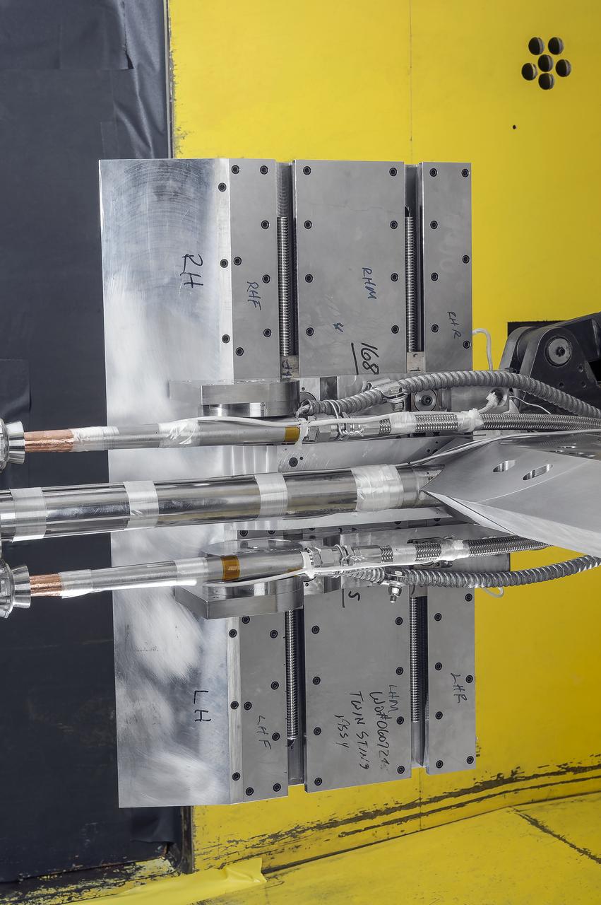 Stage Separation Test of the Space Launch System(SLS) in the Langley Unitary Plan Wind Tunnel (UPWT). The model used High Pressure air blown through the solid rocket boosters. (SRB) to simulate the booster separation motors (BSM) firing.