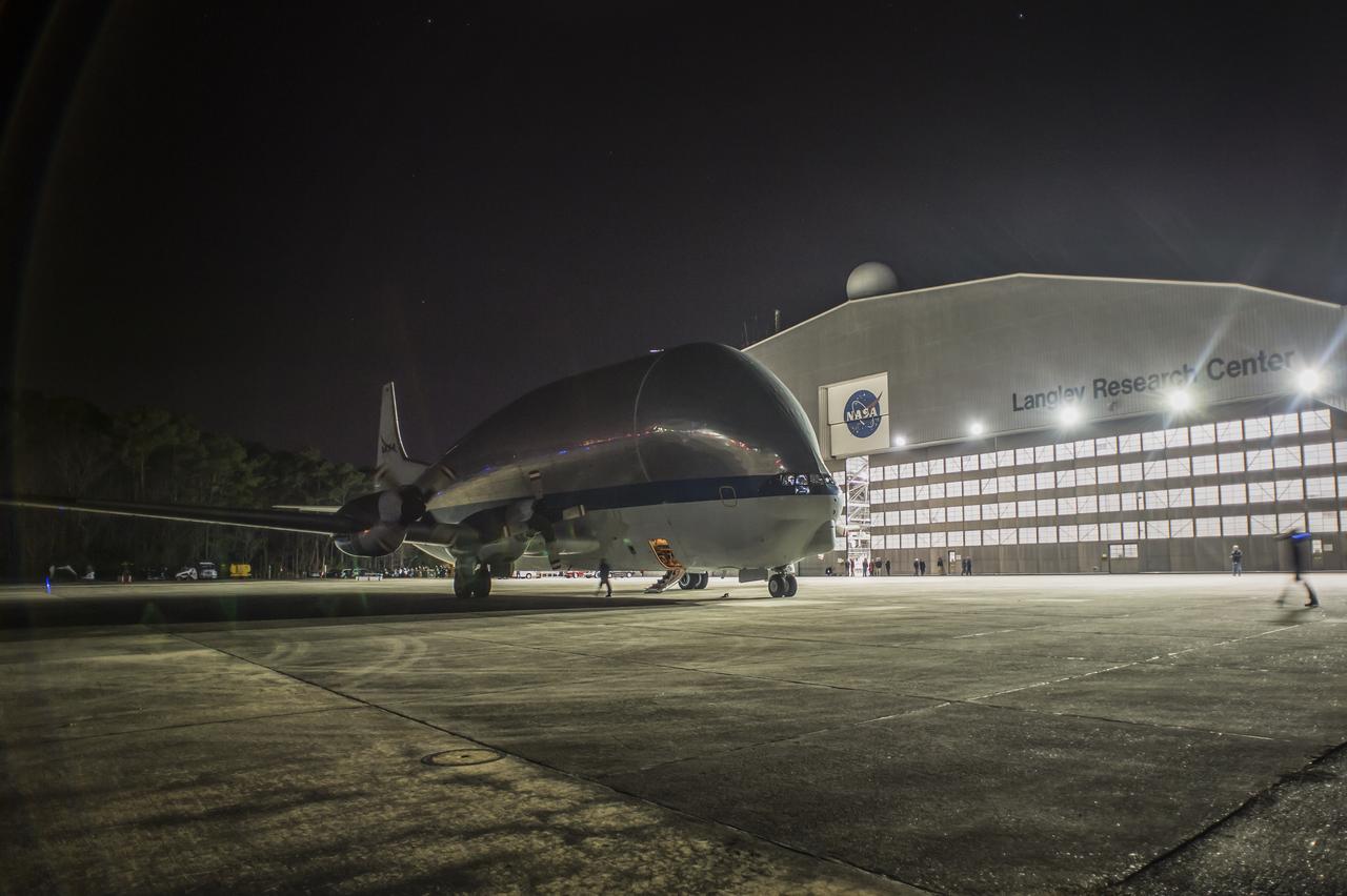 Super Guppy arrival and (MBB) Multi-Bay Box Delivery ; Super Guppy arrival and MBB Delivery: super Guppy arrival at NASA Langley hangar, and unloading of (MBB) multi-bay box, transport of MBB to COLTS and move into building 1256. 