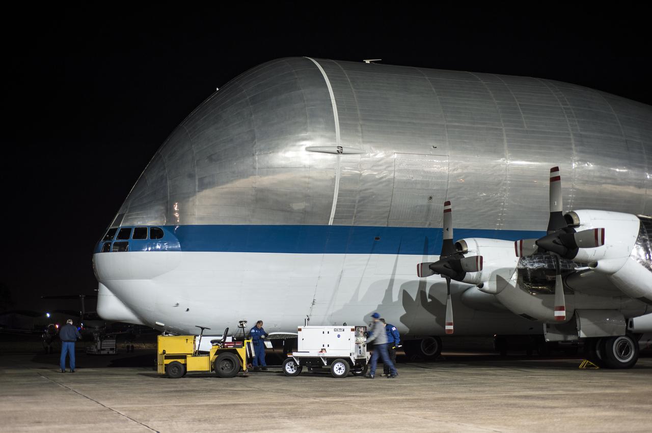 Super Guppy arrival and (MBB) Multi-Bay Box Delivery ; Super Guppy arrival and MBB Delivery: super Guppy arrival at NASA Langley hangar, and unloading of (MBB) multi-bay box, transport of MBB to COLTS and move into building 1256. 