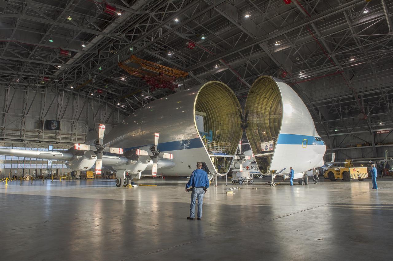 Super Guppy arrival and (MBB) Multi-Bay Box Delivery ; Super Guppy arrival and MBB Delivery: super Guppy arrival at NASA Langley hangar, and unloading of (MBB) multi-bay box, transport of MBB to COLTS and move into building 1256. 