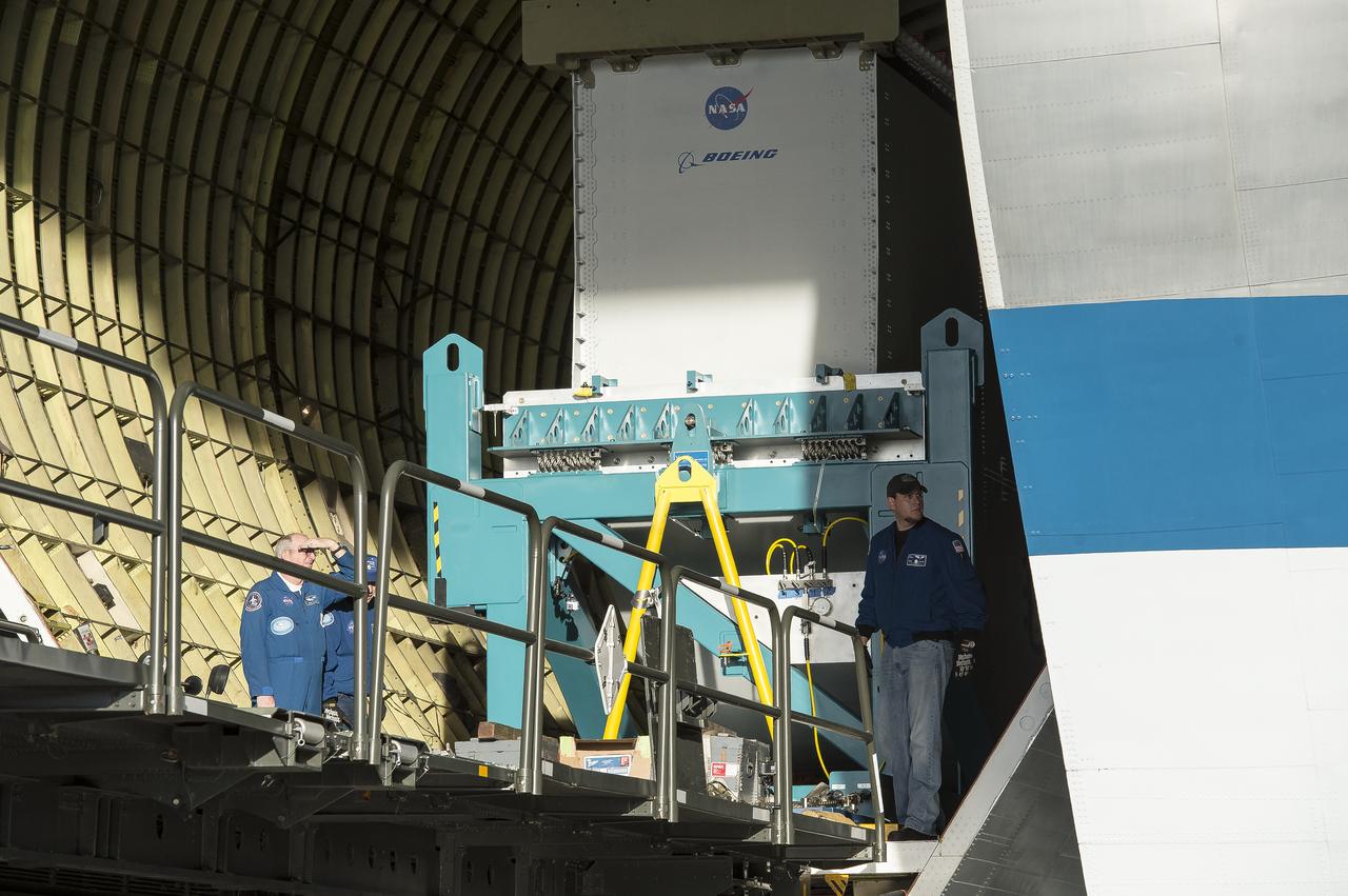 Super Guppy arrival and (MBB) Multi-Bay Box Delivery ; Super Guppy arrival and MBB Delivery: super Guppy arrival at NASA Langley hangar, and unloading of (MBB) multi-bay box, transport of MBB to COLTS and move into building 1256. 