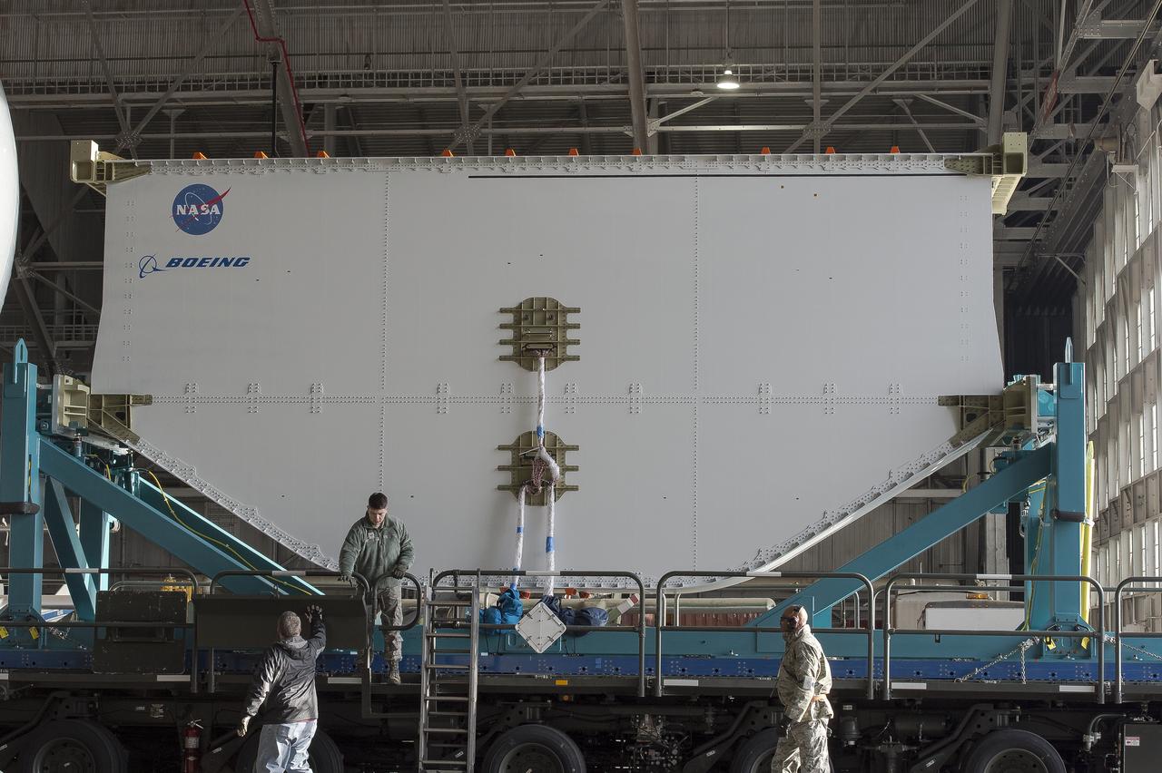 Super Guppy arrival and (MBB) Multi-Bay Box Delivery ; Super Guppy arrival and MBB Delivery: super Guppy arrival at NASA Langley hangar, and unloading of (MBB) multi-bay box, transport of MBB to COLTS and move into building 1256. 