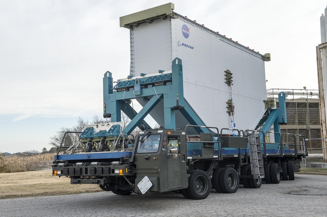 Super Guppy arrival and (MBB) Multi-Bay Box Delivery ; Super Guppy arrival and MBB Delivery: super Guppy arrival at NASA Langley hangar, and unloading of (MBB) multi-bay box, transport of MBB to COLTS and move into building 1256. 