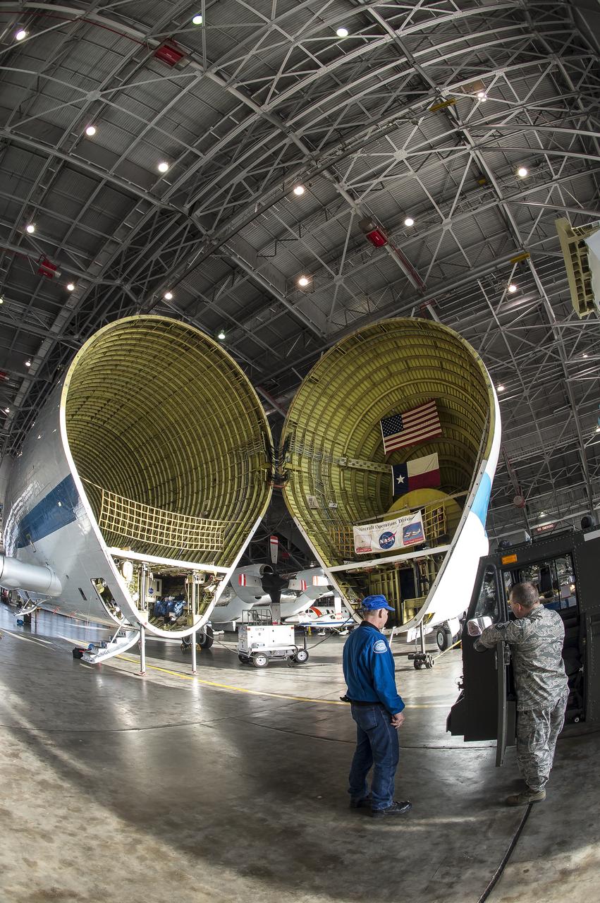 Super Guppy arrival and (MBB) Multi-Bay Box Delivery ; Super Guppy arrival and MBB Delivery: super Guppy arrival at NASA Langley hangar, and unloading of (MBB) multi-bay box, transport of MBB to COLTS and move into building 1256. 