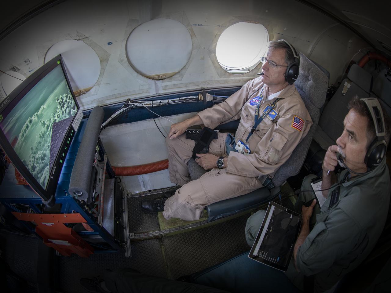 Testing the External Vision System (XVS) software on the B200 King Air. Pilots, Peter Coen and Wayne Ringelberg attempt to spot an incoming aircraft on the XVS monitor.