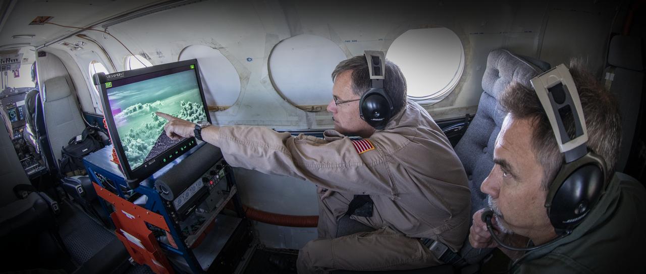 Testing the External Vision System (XVS) software on the B200 King Air. Pilots, Peter Coen and Wayne Ringelberg attempt to spot an incoming aircraft on the XVS monitor.