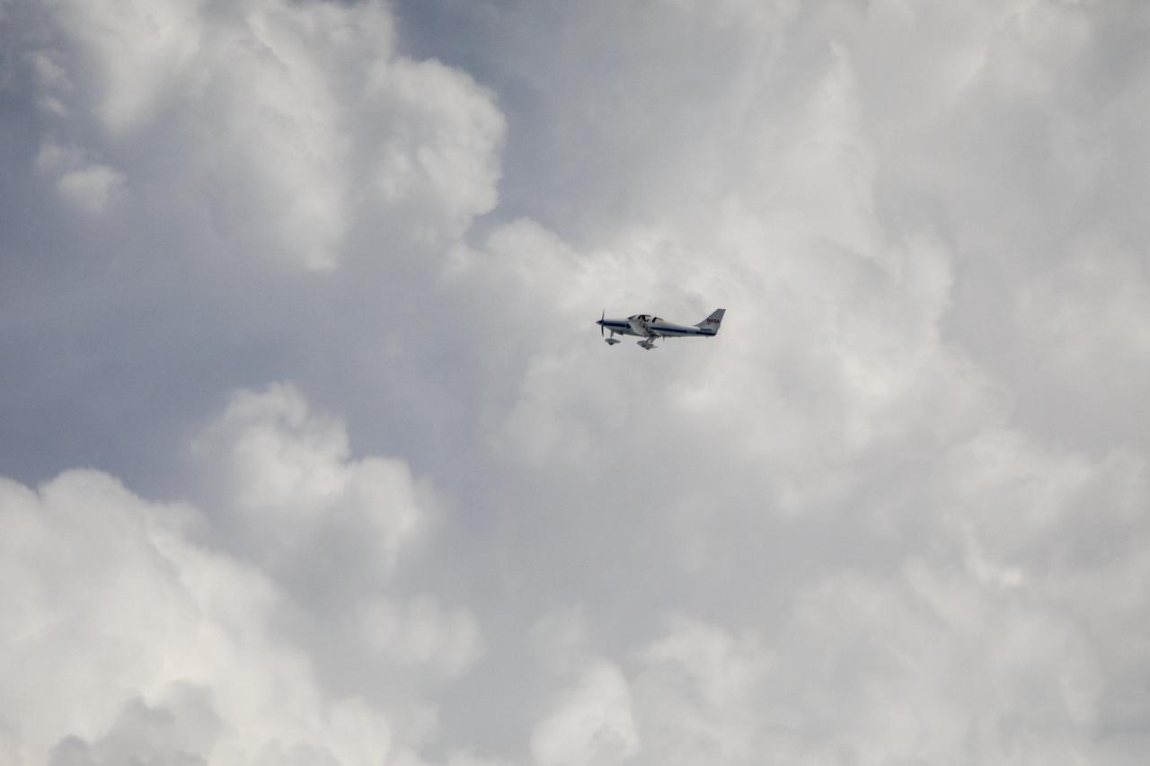 Testing the External Vision System (XVS) software on the B200 King Air. Pilots, Peter Coen and Wayne Ringelberg attempt to spot an incoming aircraft on the XVS monitor.