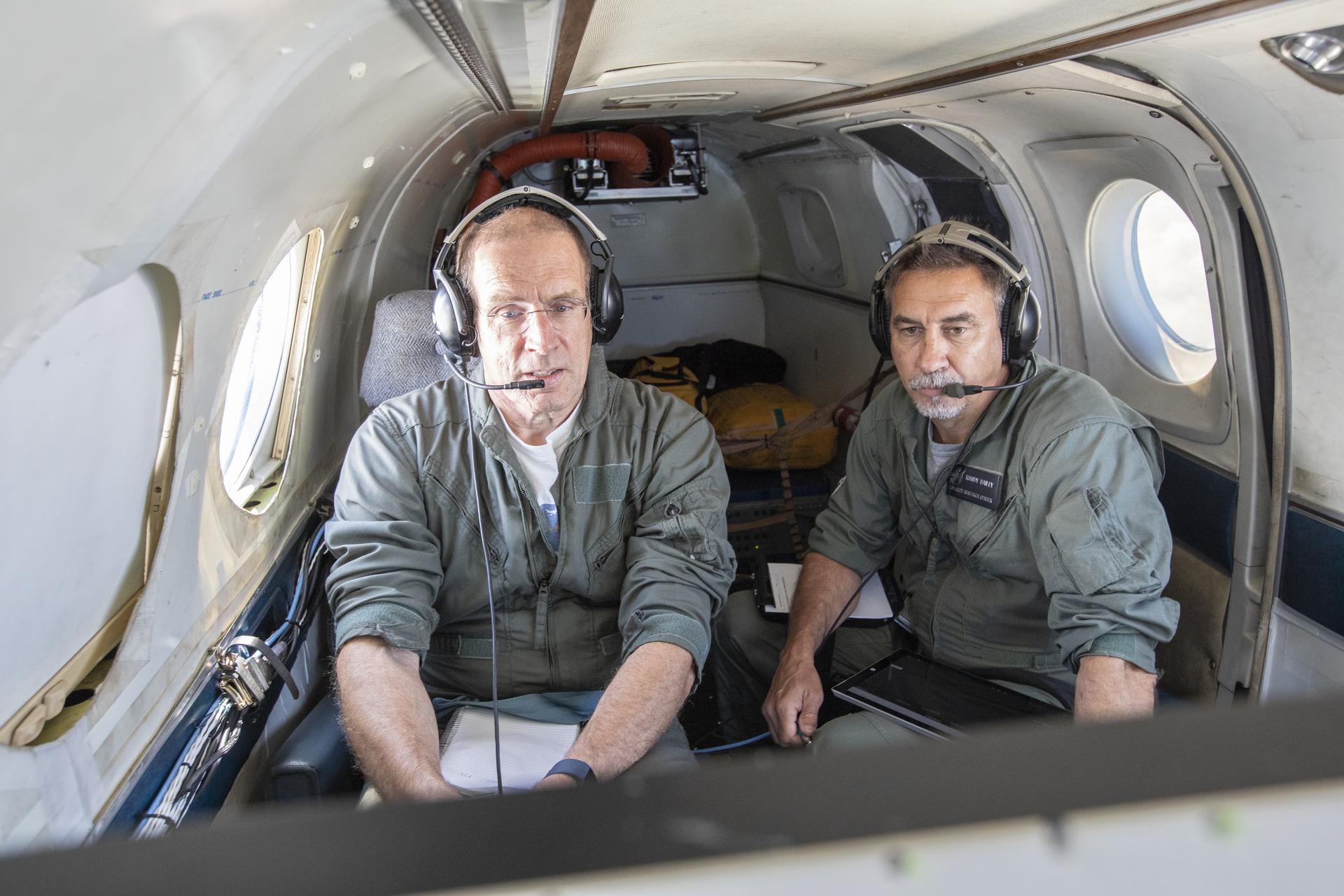 Aerospace Engineers, “from left to right” Peter Coen and Randy Bailey attempt to spot an incoming aircraft on the monitor while performing tests on the External Vision System (XVS) Software. The software testing is being conducted on the B200 King Air Beechcraft airplane.