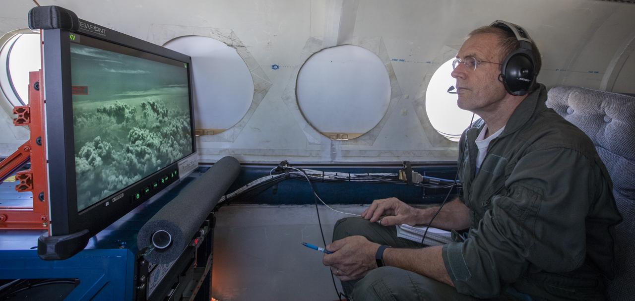 Testing the External Vision System (XVS) software on the B200 King Air. Pilots, Peter Coen and Wayne Ringelberg attempt to spot an incoming aircraft on the XVS monitor.