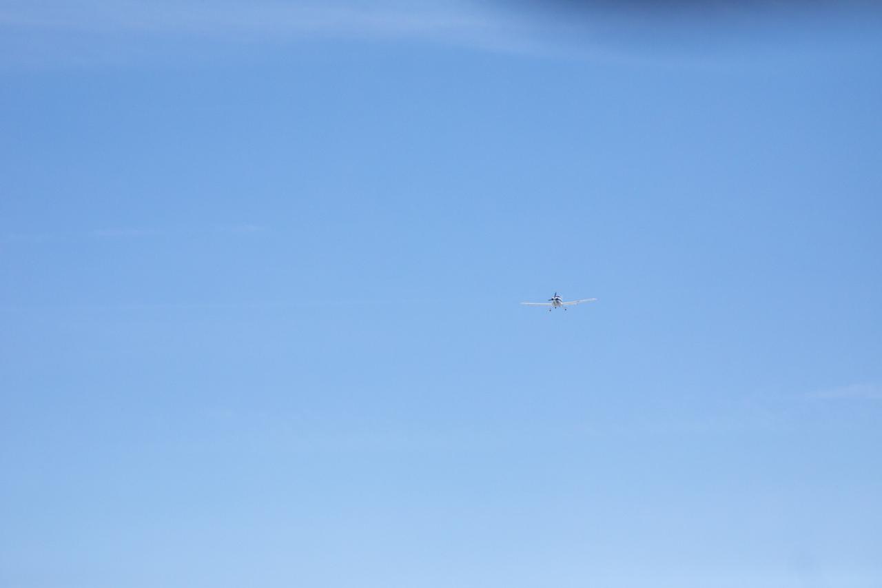 Testing the External Vision System (XVS) software on the B200 King Air. Pilots, Peter Coen and Wayne Ringelberg attempt to spot an incoming aircraft on the XVS monitor.