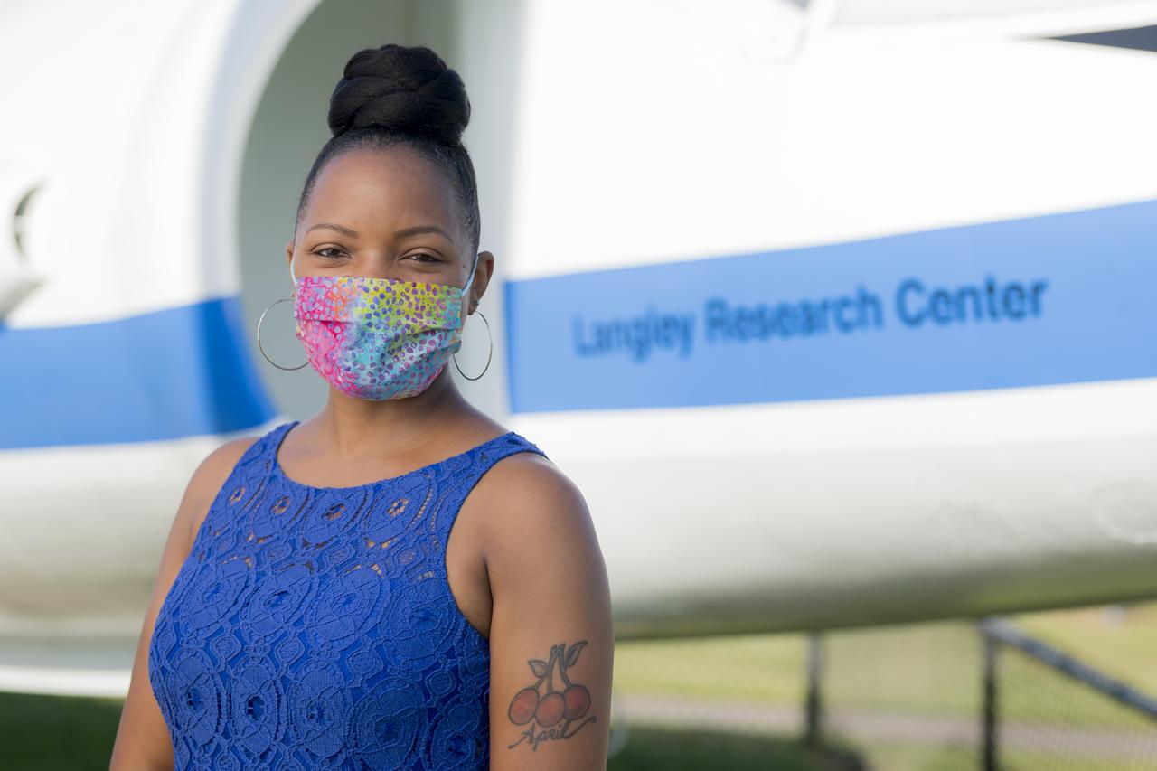 Portrait of April Albert in front of NASA Langley's Hawker Siddeley P-1127 on display at Air Power Park in Hampton, Virginia.  Due to the COVID-19 pandemic, masks were mandated by Governor Northam in Virginia in public settings.  This is for the faces of NASA project.  "I am really made to feel like I am part of a family. I don’t feel like  anybody is treated differently. We are all one team. To be a part of  NASA, to me, is to be part of something special. There is nothing like  the camaraderie of NASA. I feel like I’m where I belong.”  — April  Albert, Schedule Analyst, Langley Research Center