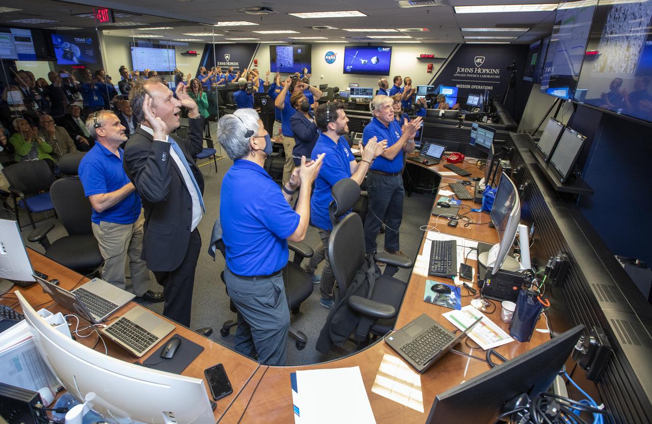 NASA’s Double Asteroid Redirection Test (DART) command team at Johns Hopkins University, Applied Physics Laboratory monitoring the DART spacecraft’s impact into the asteroid Dimorphos. The operation is the first of its kind test to redirect deadly asteroids from hitting Earth.  