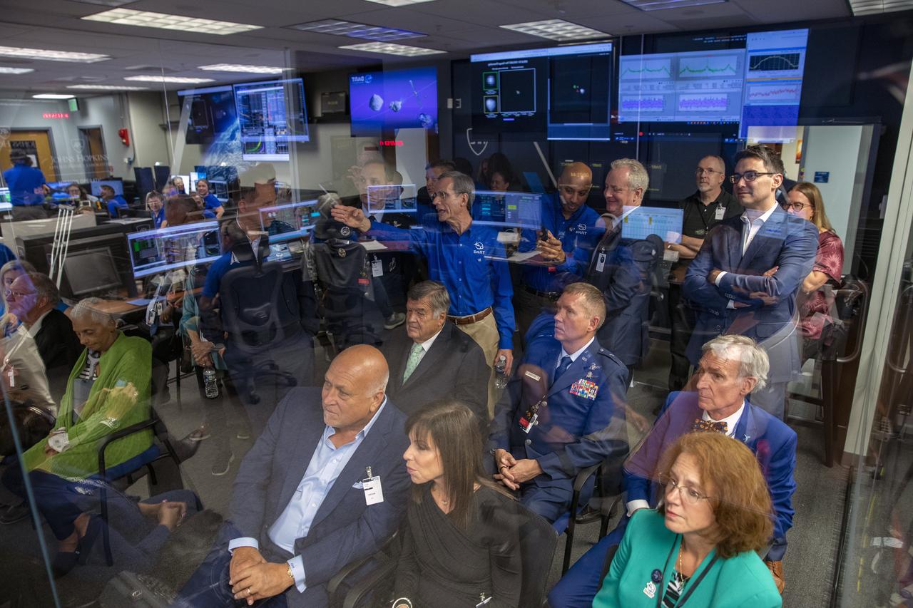 NASA’s Double Asteroid Redirection Test (DART) command team at Johns Hopkins University, Applied Physics Laboratory monitoring the DART spacecraft’s impact into the asteroid Dimorphos. The operation is the first of its kind test to redirect deadly asteroids from hitting Earth.  