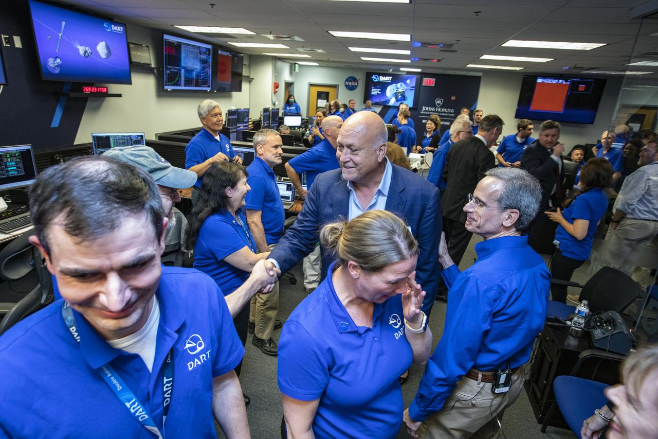 NASA’s Double Asteroid Redirection Test (DART) command team at Johns Hopkins University, Applied Physics Laboratory monitoring the DART spacecraft’s impact into the asteroid Dimorphos. The operation is the first of its kind test to redirect deadly asteroids from hitting Earth.  