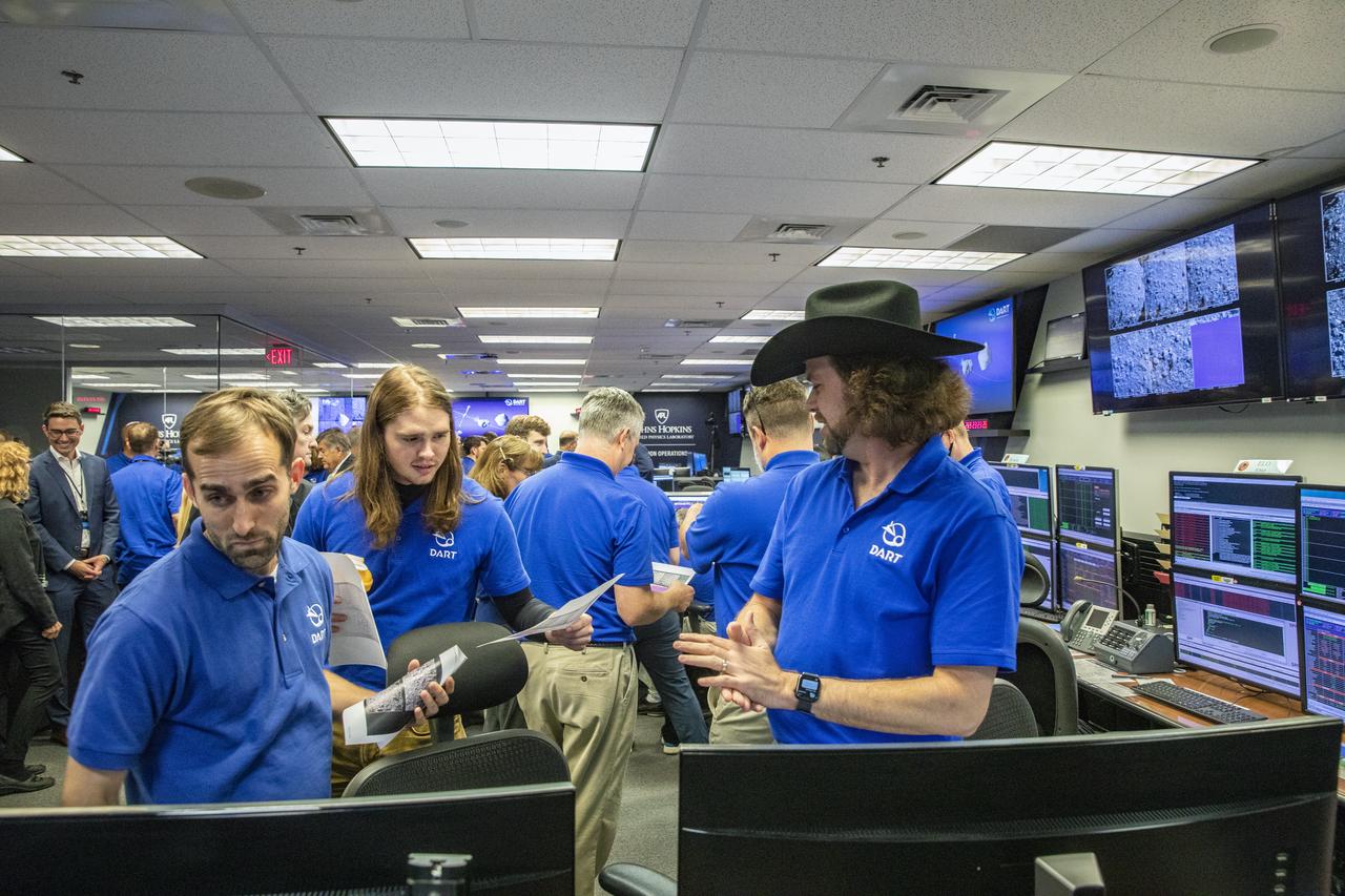 NASA’s Double Asteroid Redirection Test (DART) command team at Johns Hopkins University, Applied Physics Laboratory monitoring the DART spacecraft’s impact into the asteroid Dimorphos. The operation is the first of its kind test to redirect deadly asteroids from hitting Earth.  