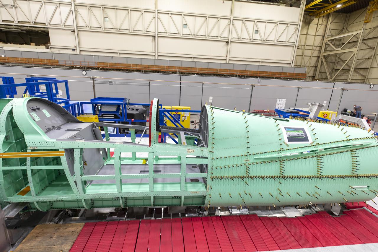 Event: SEG 210 Forebody A right side view of where the team is preparing the X-59 structure for installation of the forward fuselage, which contains the cockpit. The aircraft, under construction at Lockheed Martin Skunk Works in Palmdale, California, will fly to demonstrate the ability to fly supersonic while reducing the loud sonic boom to a quiet sonic thump.