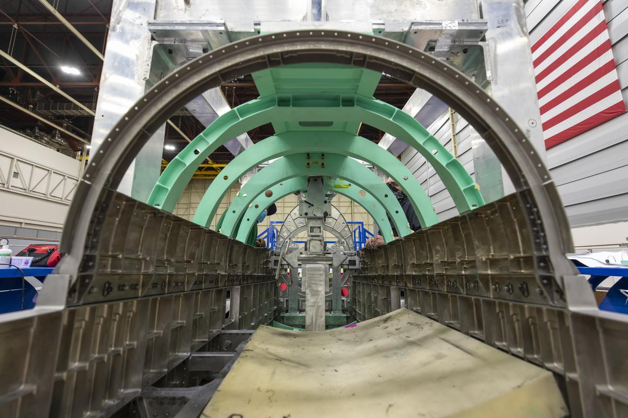 Event: SEG 510 Upper Empennage An inside peek at the X-59 gives us a view from the aft end looking at the engine bay. Later in the assembly process, the engine will be placed inside this section. The aircraft, under construction at Lockheed Martin Skunk Works in Palmdale, California, will demonstrate the ability to fly supersonic while reducing the loud sonic boom to a quiet sonic thump.