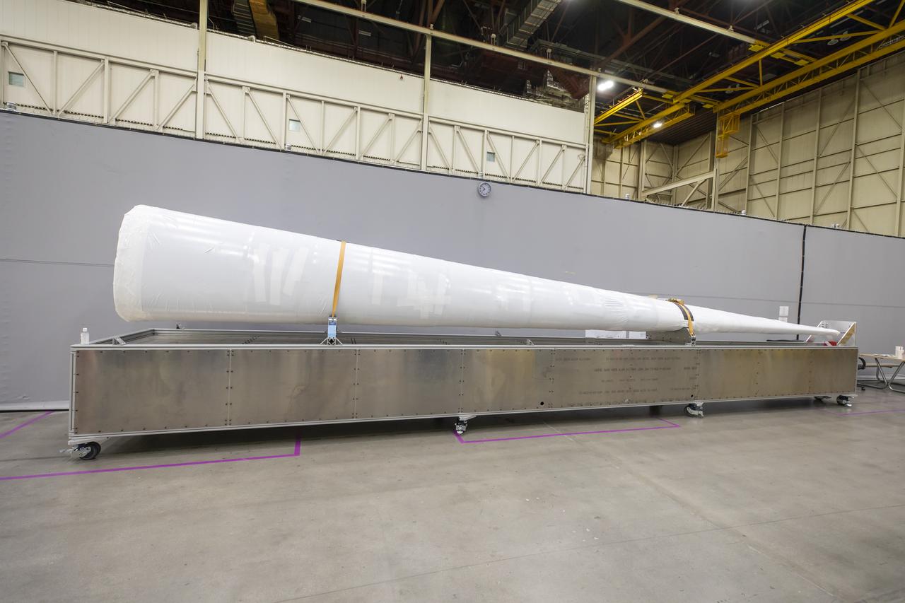 Event: SEG 230 Nose The X-59’s nose is wrapped up safely and rests on a dolly before the team temporarily attaches it to the aircraft for fit checks at Lockheed Martin in Palmdale, California. The full length of the X-plane’s nose is 38-feet – making up one third of the plane’s full length. The aircraft, under construction at Lockheed Martin Skunk Works in Palmdale, California, once in the air will demonstrate the ability to fly supersonic while reducing the loud sonic boom to a quiet sonic thump.