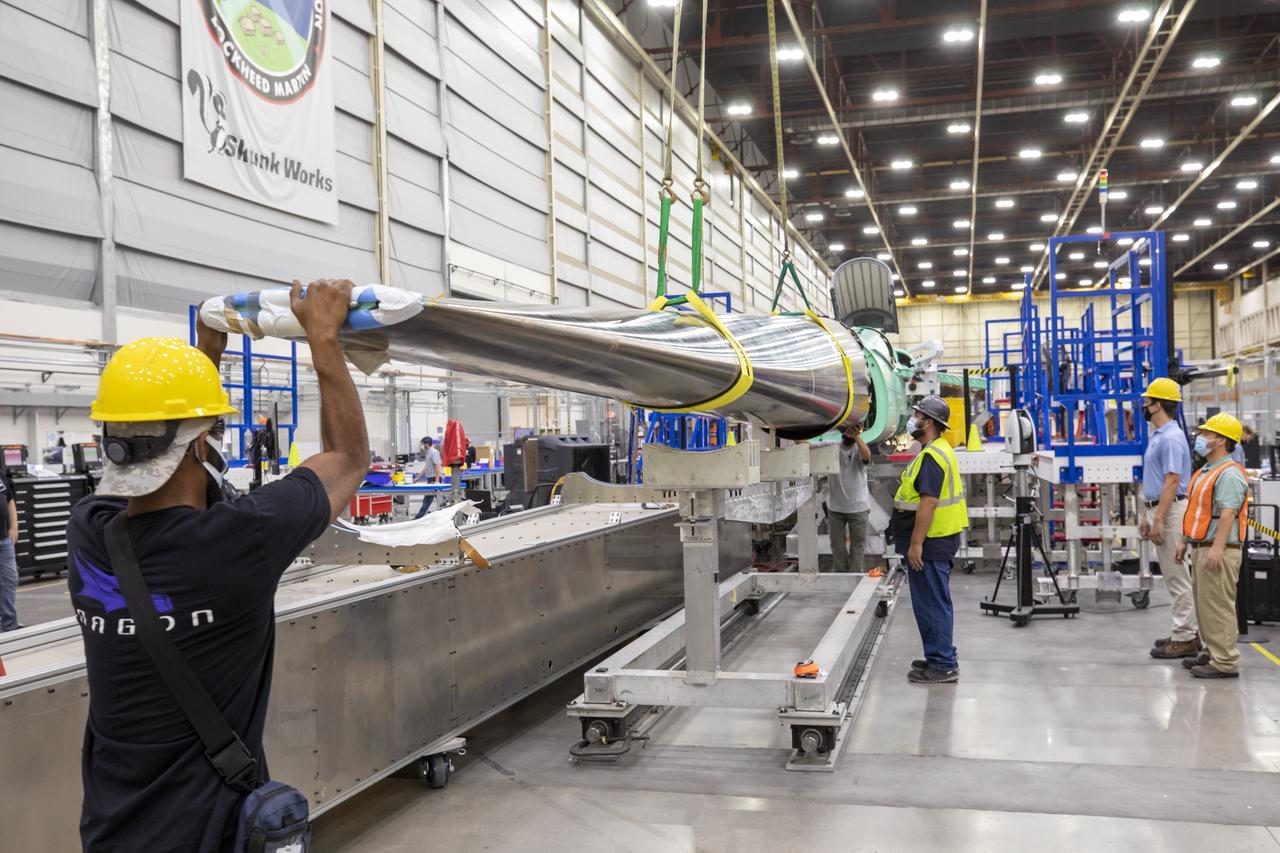 Event: SEG 230 Nose - Craned Onto Tooling A close-up of the X-59’s duckbill nose, which is a crucial part of its supersonic design shaping. The team prepares the nose for a fit check. The X-59’s nose is 38-feet long – approximately one third of the length of the entire aircraft. The aircraft, under construction at Lockheed Martin Skunk Works in Palmdale, California, will demonstrate the ability to fly supersonic while reducing the loud sonic boom to a quiet sonic thump.